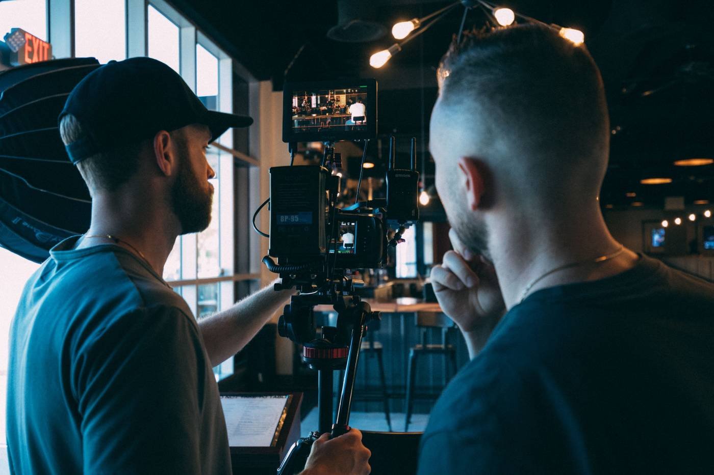 Film crew reviewing footage during a professional commercial video production